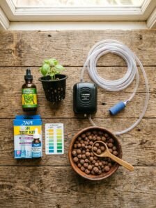 Essential hydroponic equipment including air pump, pH kit, nutrients and growing medium